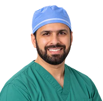 Dr. Muhammad T. Padela in surgical scrubs